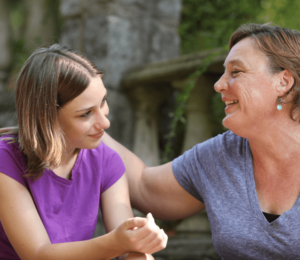 Transitioning Autistic Teens to life after high school - Photo of a mother talking to her daughter outdoors