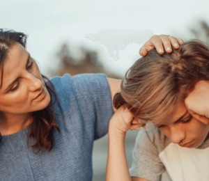 Parenting a Neurodivergent Child - image shows a mum comforting her neurodivergent teenage son